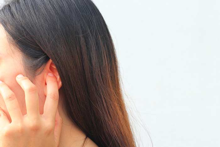 Girl Putting Finger On Her Ears